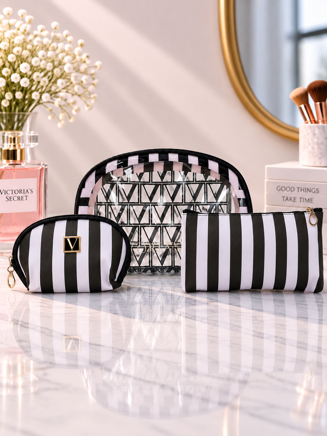 Black and white striped cosmetic organizer set with small pouch and V logo